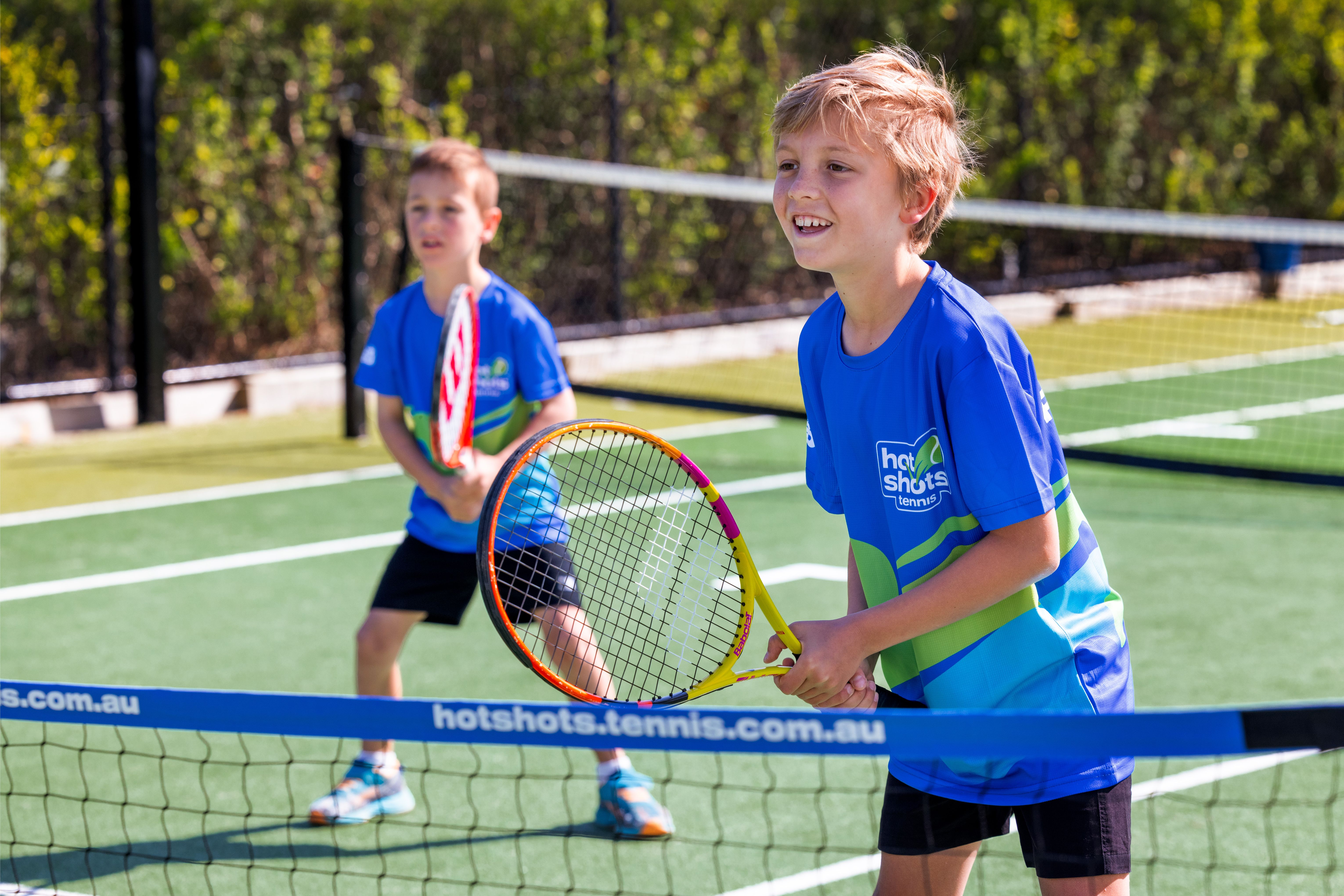 Children taking part in a Hot Shots tennis session